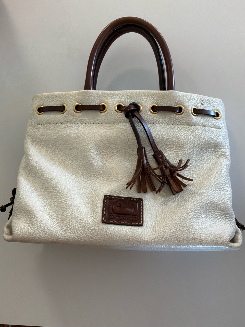Dooney & Bourke White Pebbled Leather Satchel with Brown Trim and Tassel